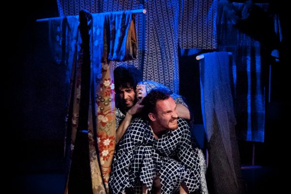 The Rain Naritsune (Andrew Woolner) and Yasuyori (Graig Russell) hide in an improvised shelter as the rain falls on Kikai-ga-shima.