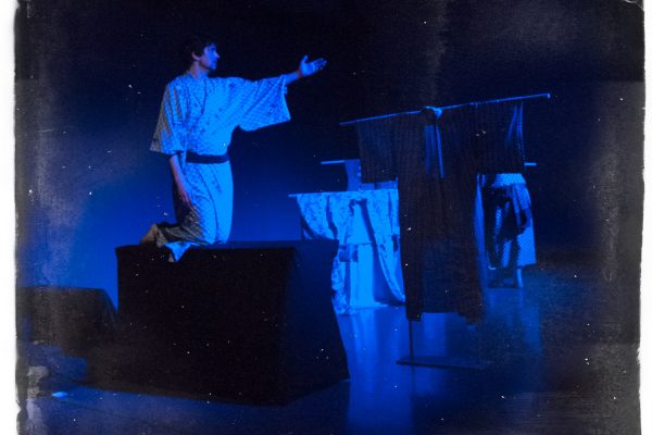 Boat Ride Naritsune (Andrew Woolner) rides the boat across the stage in Kikai-ga-shima.